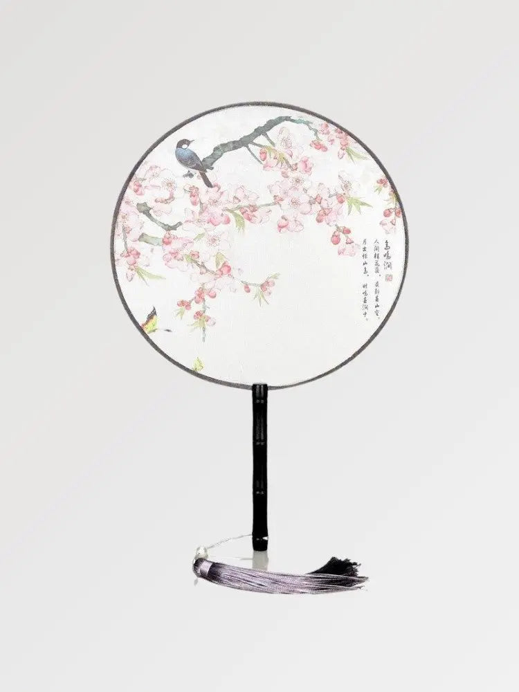 Abanico japonés uchiwa redondo Kiyosu blanco con sakura rosa y un pájaro posado Ropa Japonesa