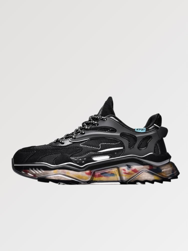 Zapatillas chunky 'Kariya' en negro — corte negro integral sobre suela translúcida con motivo multicolor, foto de producto sobre fondo claro