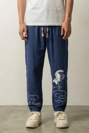 Pantalón japonés Tsuru rojo burdeos con bordado de grulla blanca en la pantorrilla Ropa Japonesa