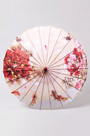Sombrilla japonesa 'Blossom' vista desde arriba, abierta en plano — tela blanca con ramas de cerezo rosas que corren hacia el centro